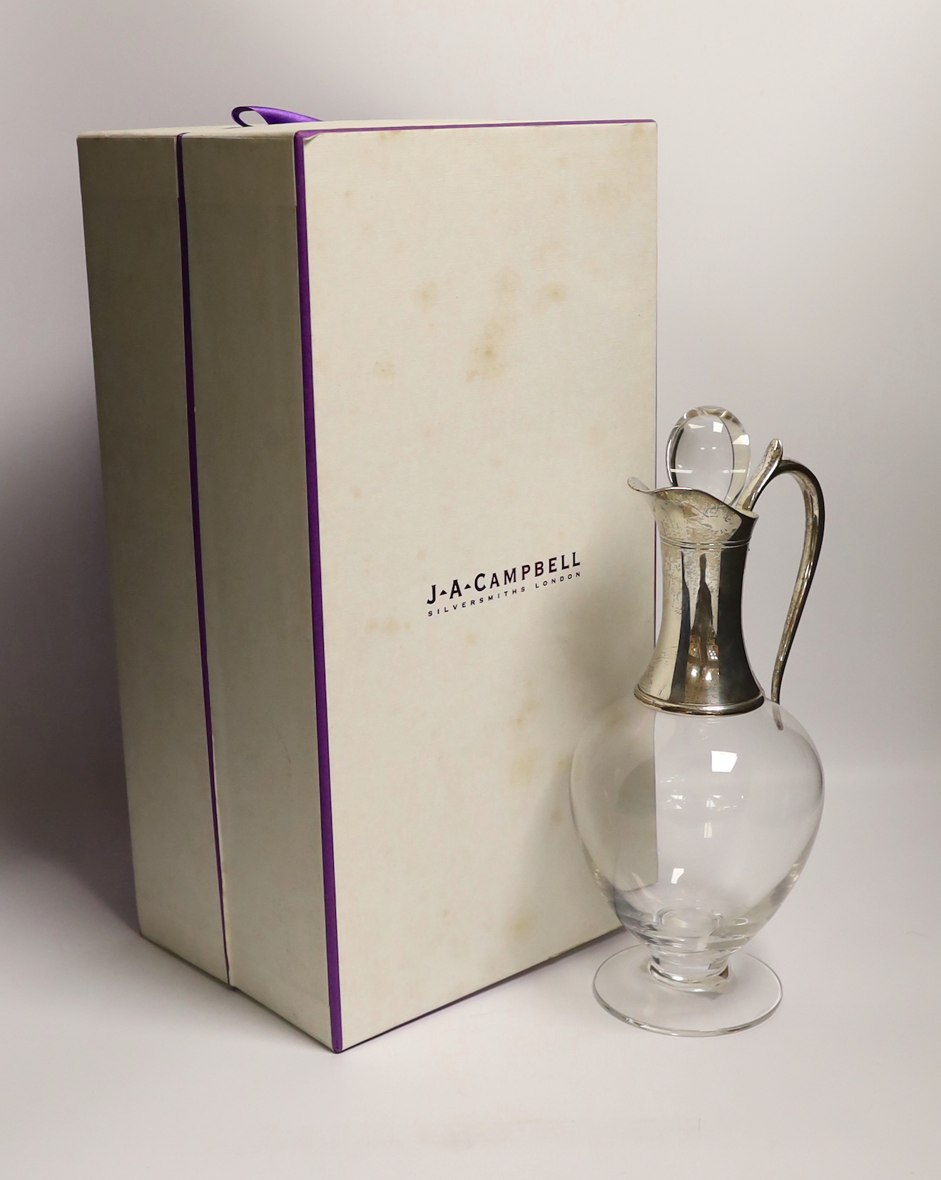 An Elizabeth II silver mounted glass claret jug and stopper, by J.A. Campbell, 2004, height 28.2 excl. stopper, in original fitted box.